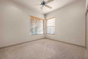 Spare room with ceiling fan and light colored carpet