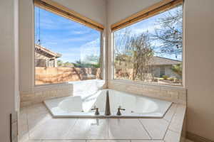 Bathroom featuring a tub with jets