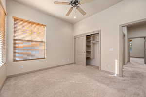 Unfurnished bedroom with light colored carpet, a closet, a ceiling fan, and recessed lighting