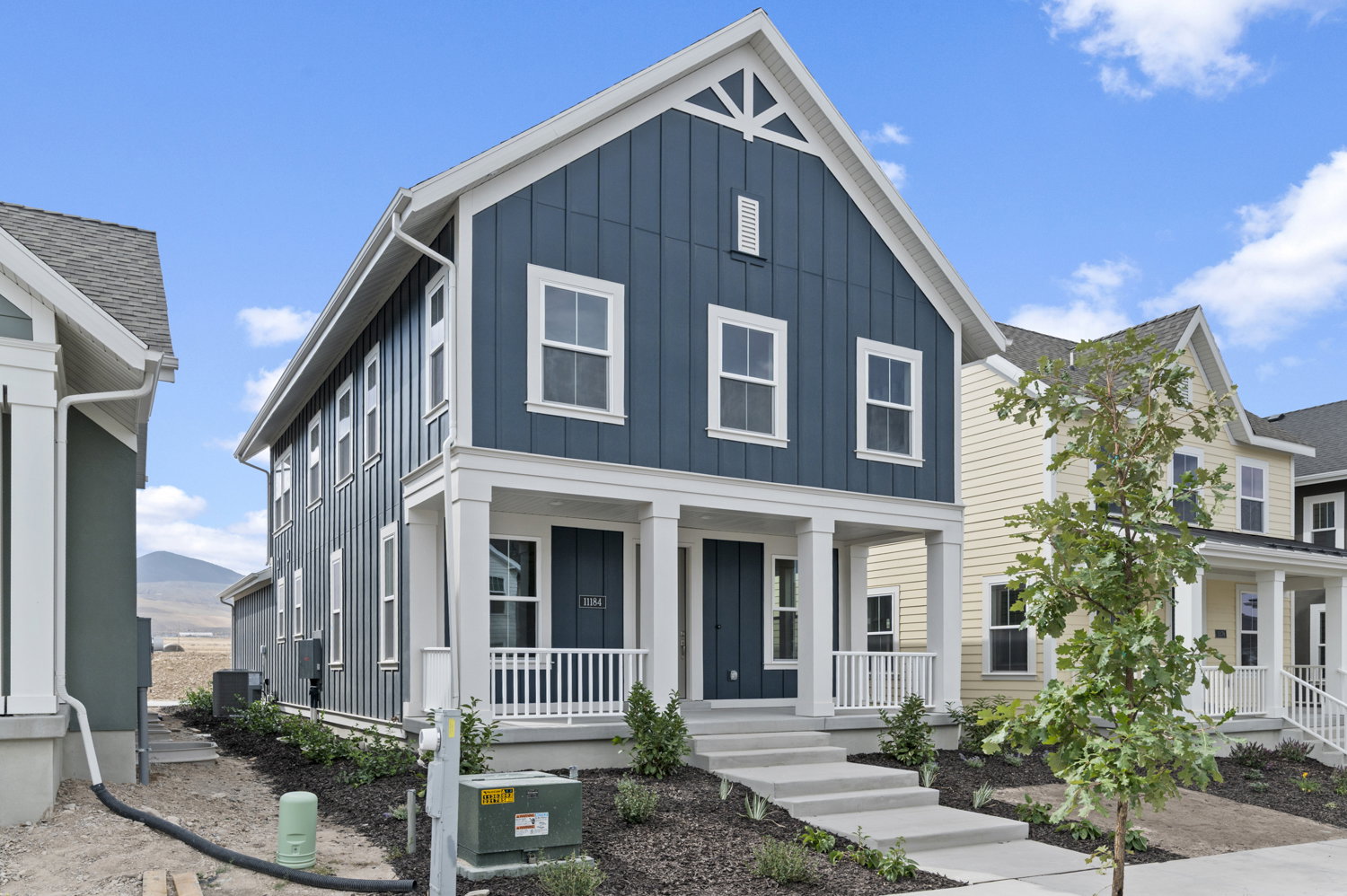 View of front facade featuring board and batten siding and a porch