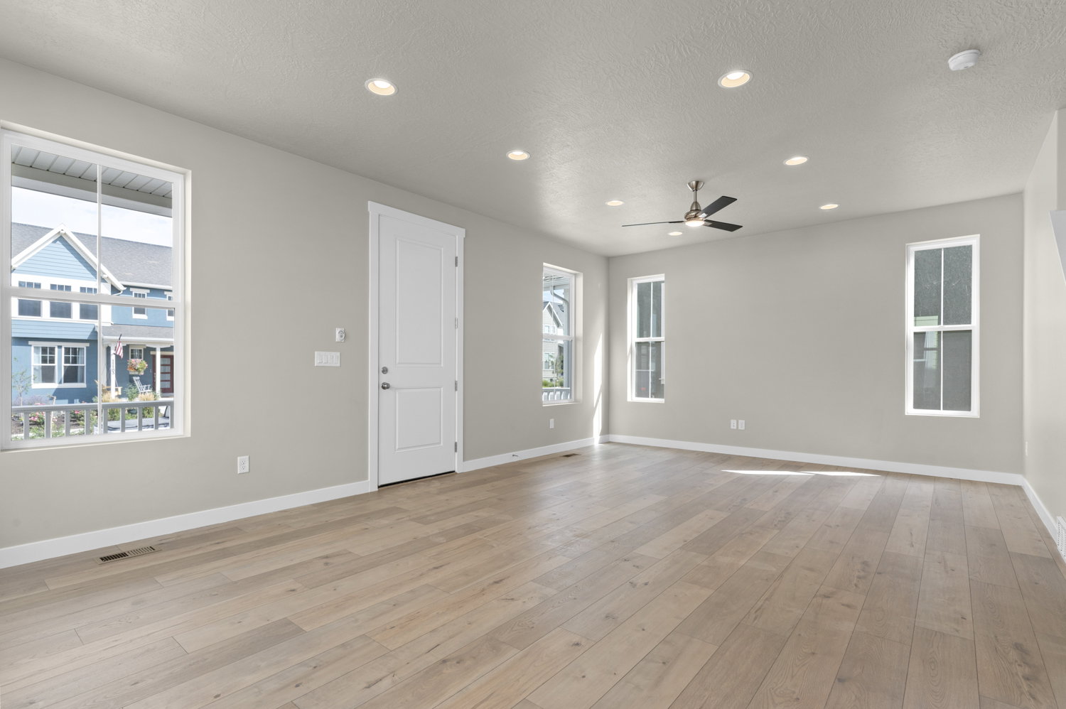 Unfurnished room with recessed lighting, light wood-style floors, a textured ceiling, and ceiling fan