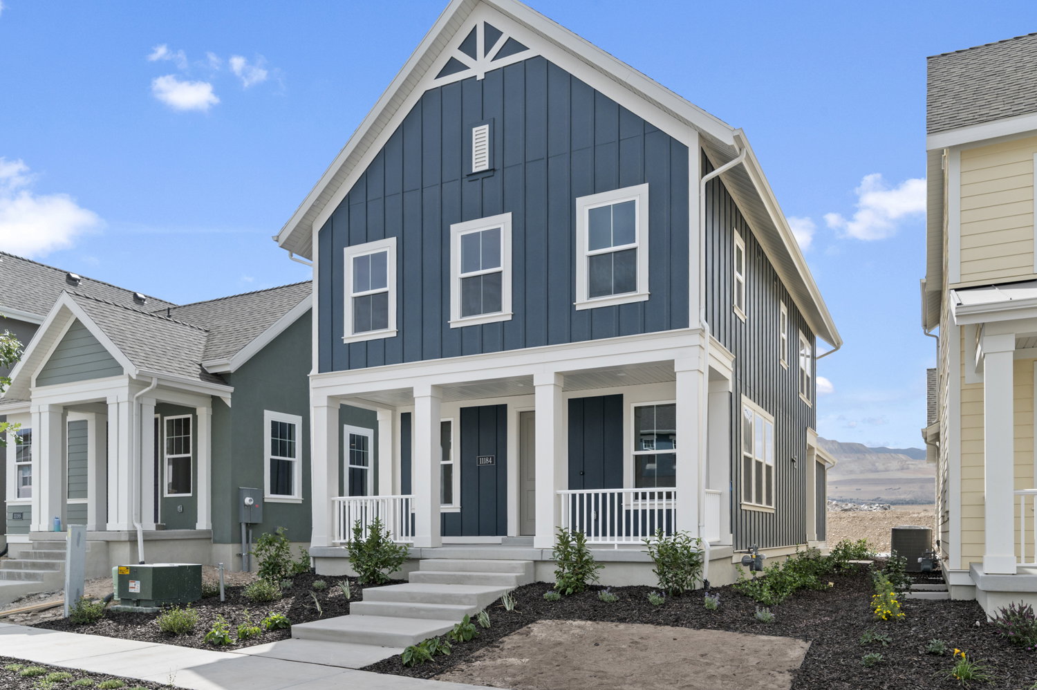 View of front of house featuring board and batten siding and a porch