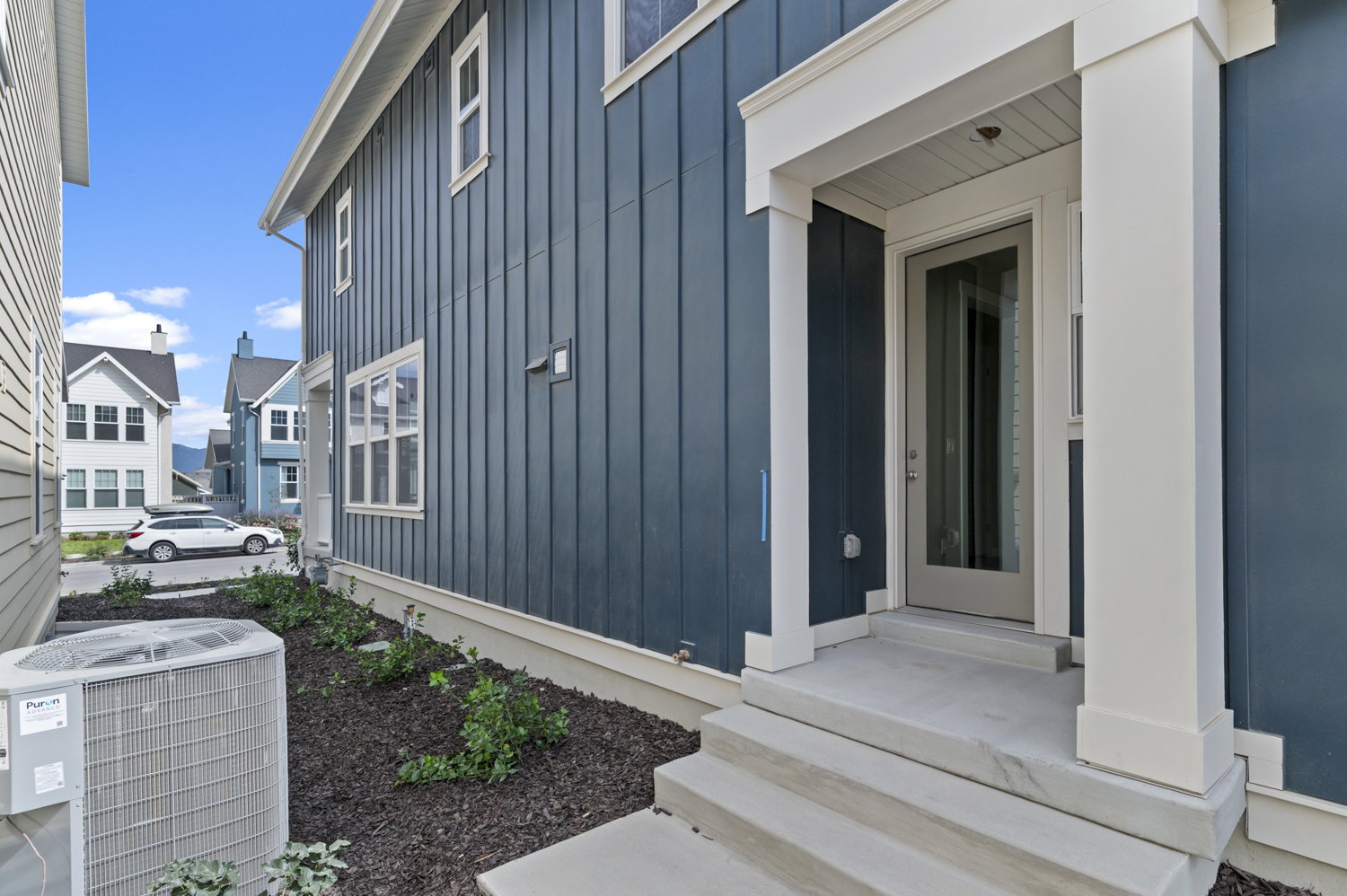 Entrance to property with board and batten siding