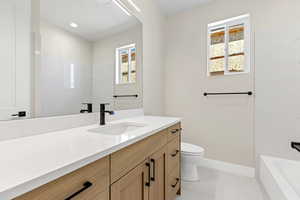 Bathroom featuring vanity and a bathtub