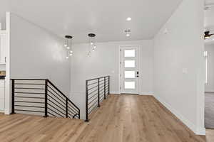 Foyer featuring light wood-style flooring and recessed lighting