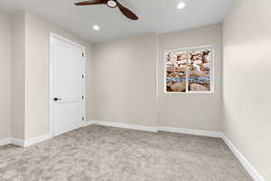 Unfurnished room featuring ceiling fan, light carpet, and recessed lighting
