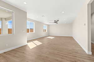 Unfurnished room featuring light wood-style floors, recessed lighting, and a ceiling fan