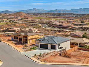 Aerial perspective of suburban area with a mountainous background