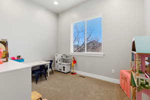 Office featuring light carpet and recessed lighting