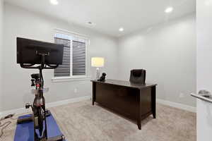 Office space featuring carpet and recessed lighting