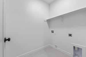 Laundry area featuring washer hookup, hookup for an electric dryer, and light tile patterned flooring