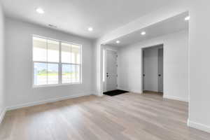 Entrance foyer featuring light wood-style flooring and recessed lighting