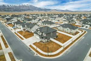 Aerial perspective of suburban area featuring a mountainous background
