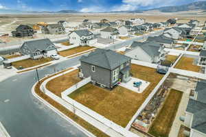 Aerial perspective of suburban area with a mountain backdrop