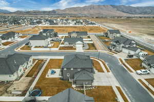 Aerial perspective of suburban area with a mountain backdrop