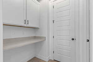 Unfurnished office with light wood finished floors and baseboards