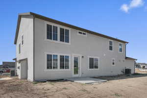 Rear view of property with a patio and stucco siding