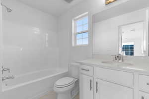 Bathroom featuring vanity and shower / washtub combination