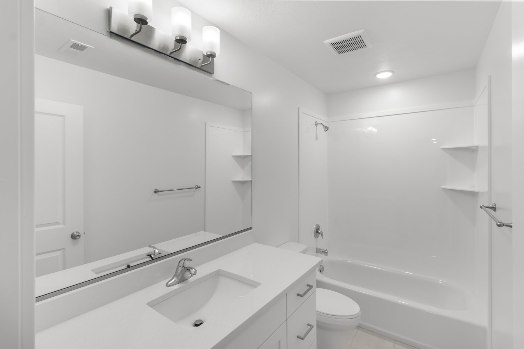 Full bathroom with vanity,  shower combination, and light tile patterned floors