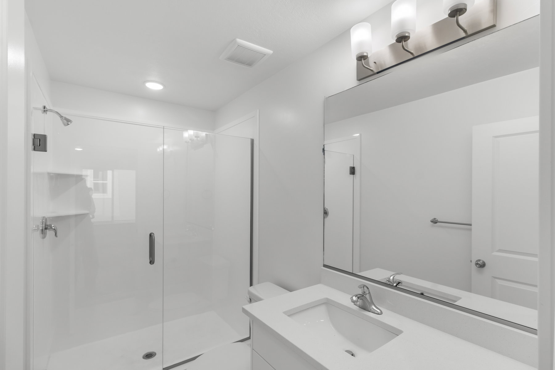 Full bathroom with a stall shower and vanity
