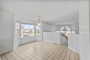 Spacious dining area with a bay window for lots of natural light