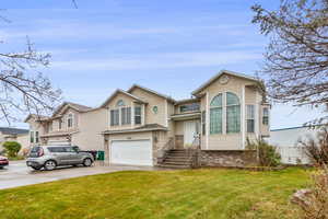 Large windows, 2-car garage, and 31' RV parking on the side of home