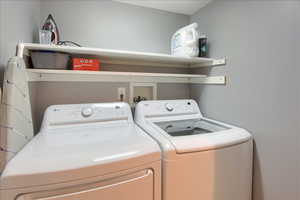 Laundry room with washer and clothes dryer