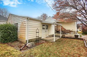 Rear view of house featuring a patio area and a yard