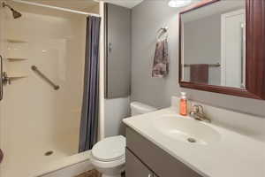 Full bathroom featuring vanity and a shower stall