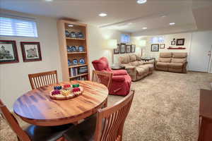 Dining space featuring carpet flooring and recessed lighting