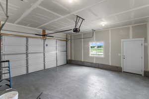 Garage featuring a garage door opener