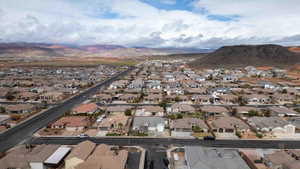 Aerial perspective of suburban area with a mountain backdrop