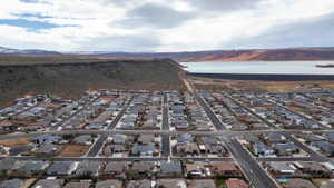 Aerial view of residential area featuring a water and mountain view