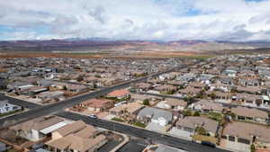 Aerial view of residential area featuring a mountainous background