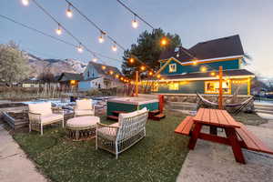 Fenced backyard featuring a patio and a jacuzzi
