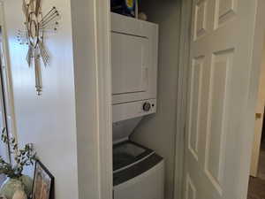 Laundry area featuring stacked washer / dryer