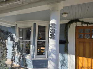 Doorway to property featuring a porch