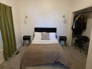 Main Floor bedroom with a closet and baseboards