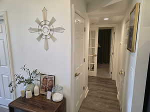 Hall with recessed lighting and dark wood-type flooring