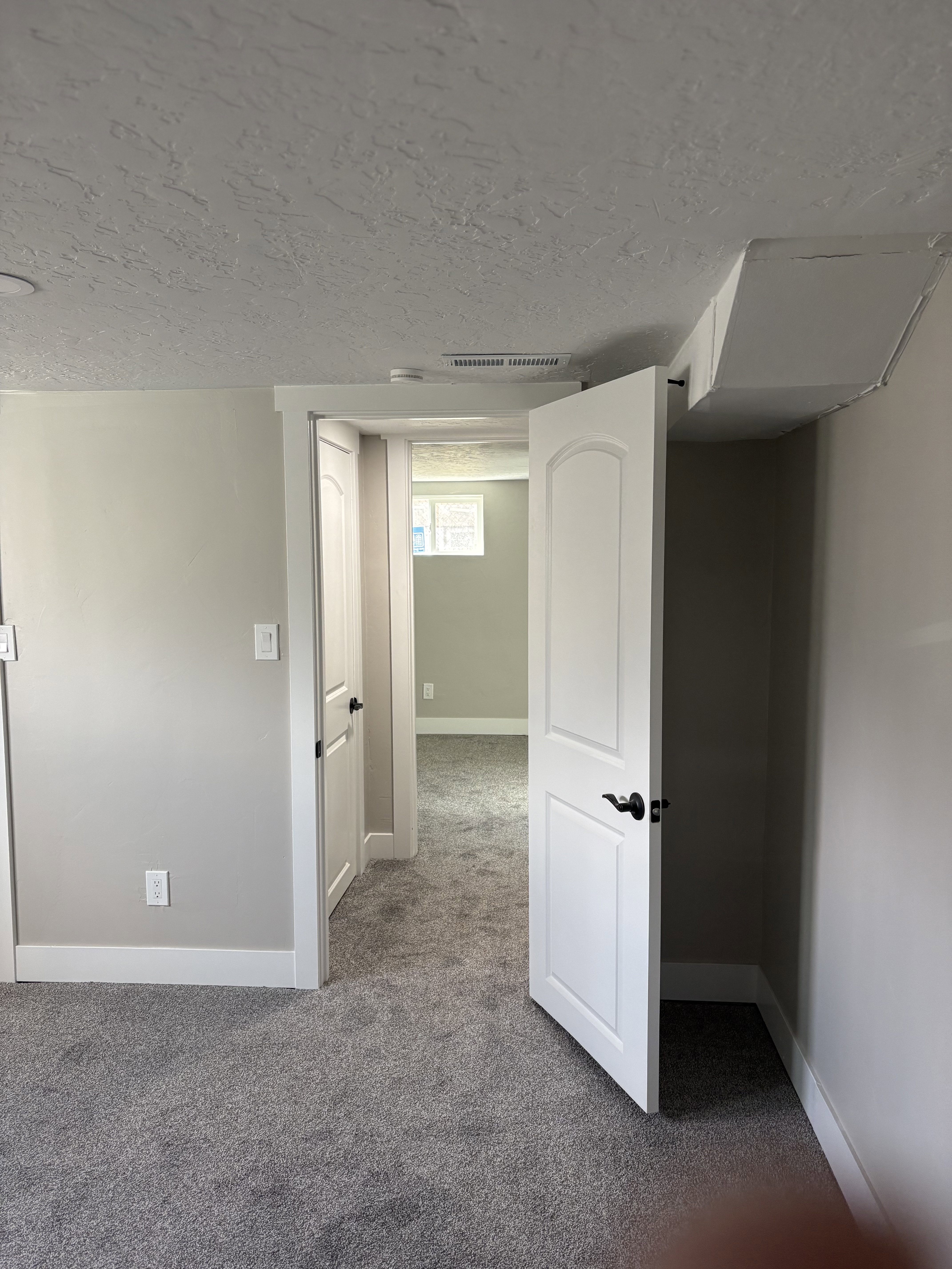 Bedroom 3 light grey carpet floors and a textured ceiling