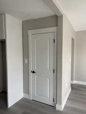 Detailed view of a textured ceiling and wood finished floors
