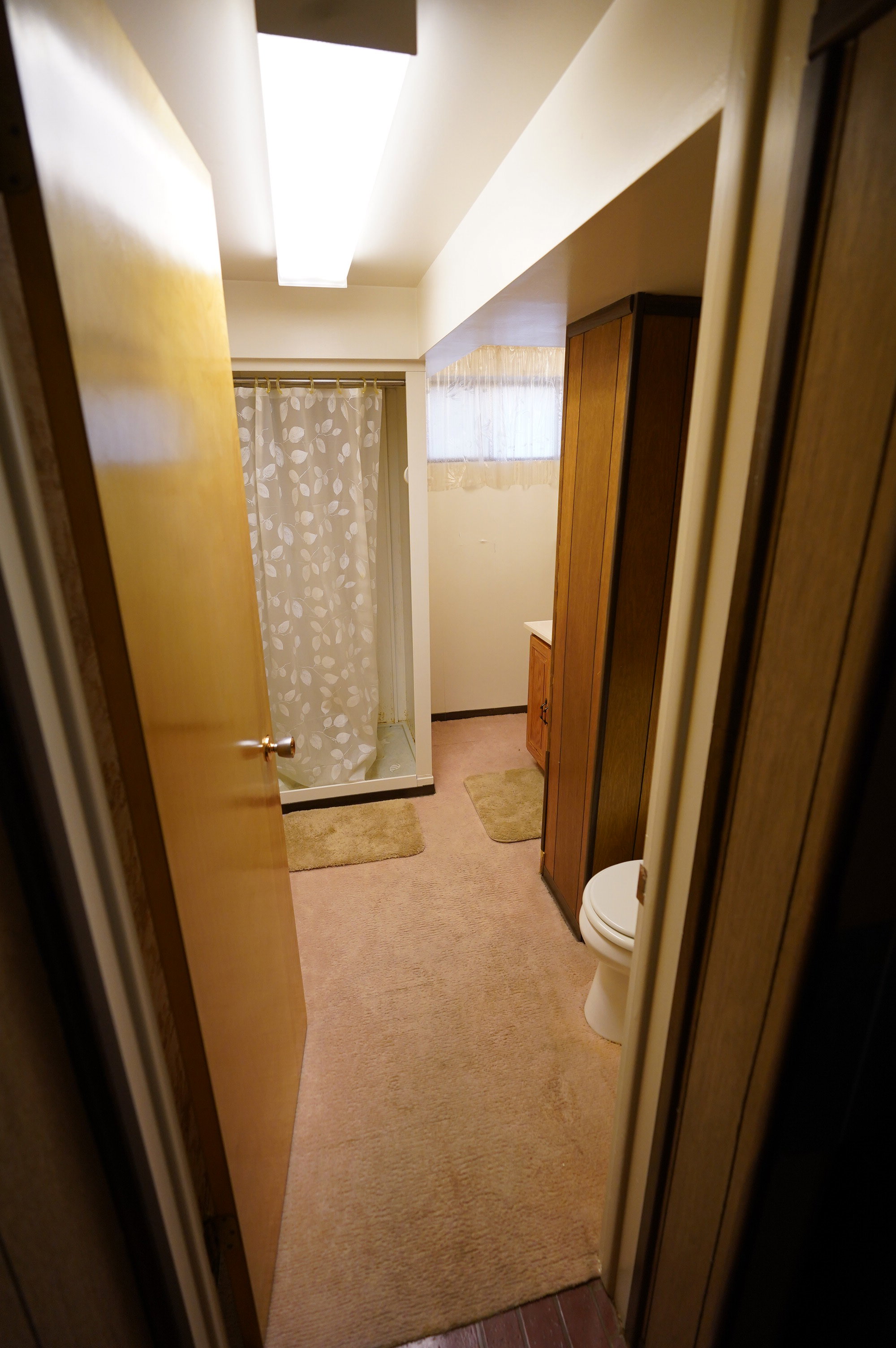 Bathroom featuring vanity and a shower stall