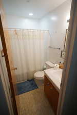 Full bath with vanity and a shower with shower curtain