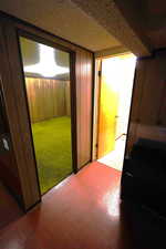 Hall featuring wood walls