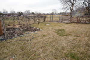 Fenced yard with a view of countryside