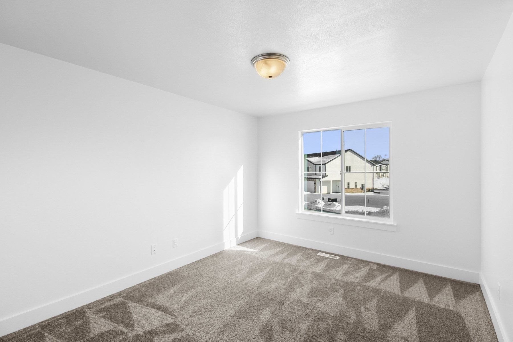 Unfurnished room with baseboards and light colored carpet