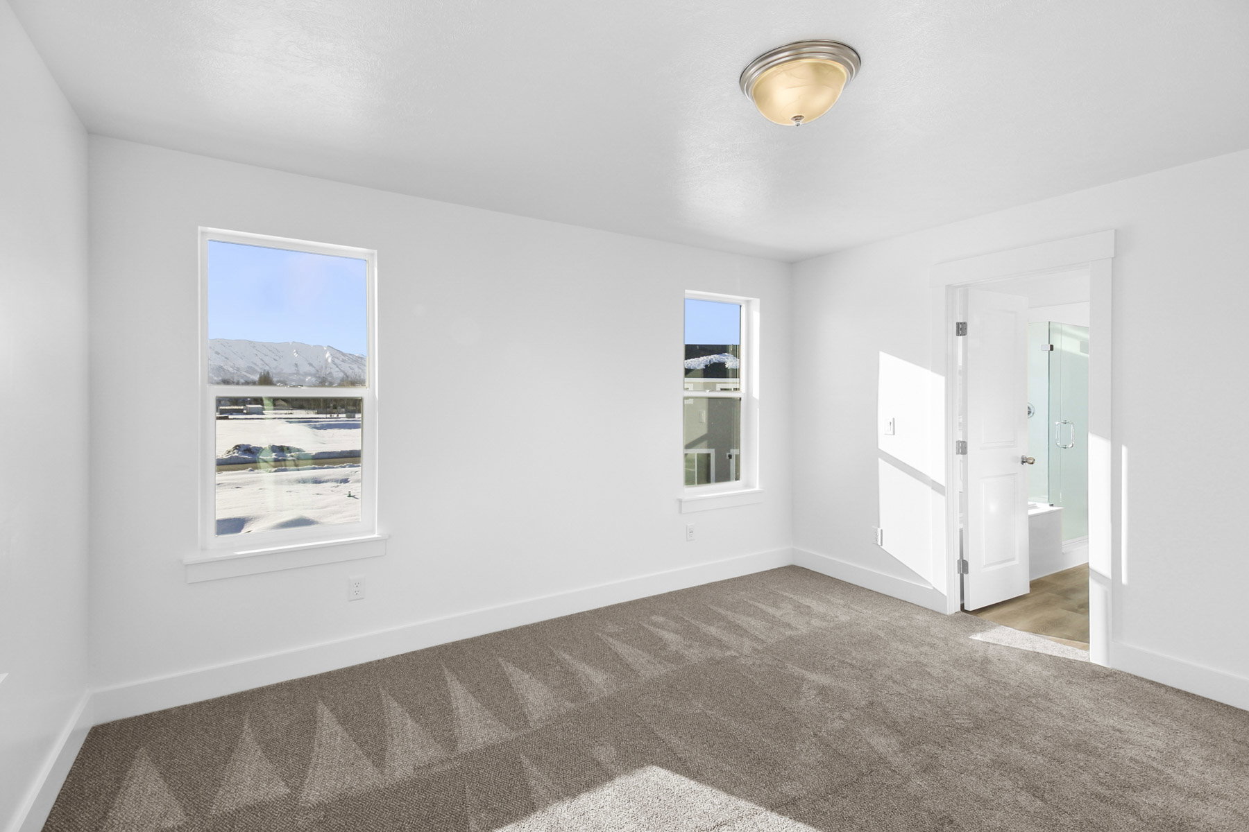 Unfurnished bedroom with baseboards and carpet flooring