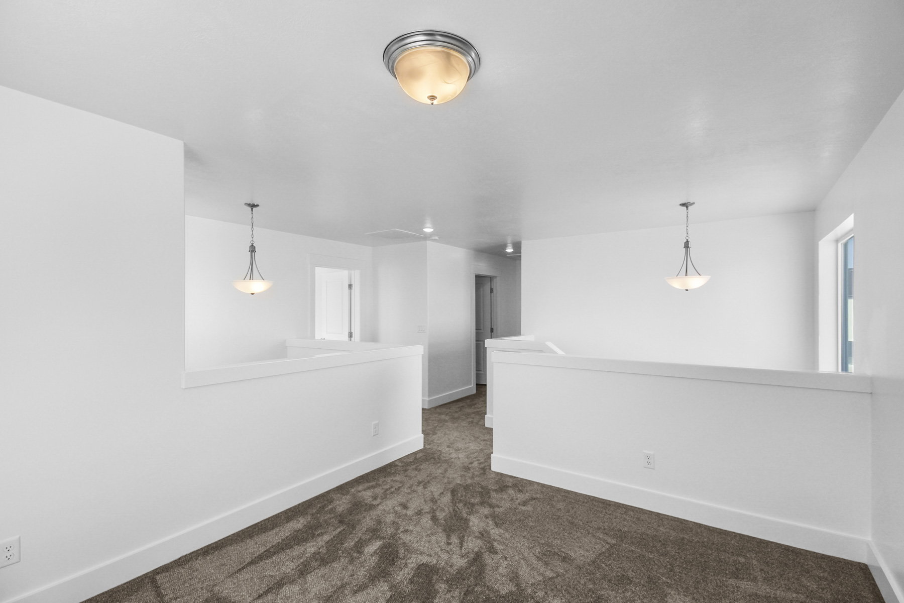 Unfurnished room with baseboards and dark colored carpet