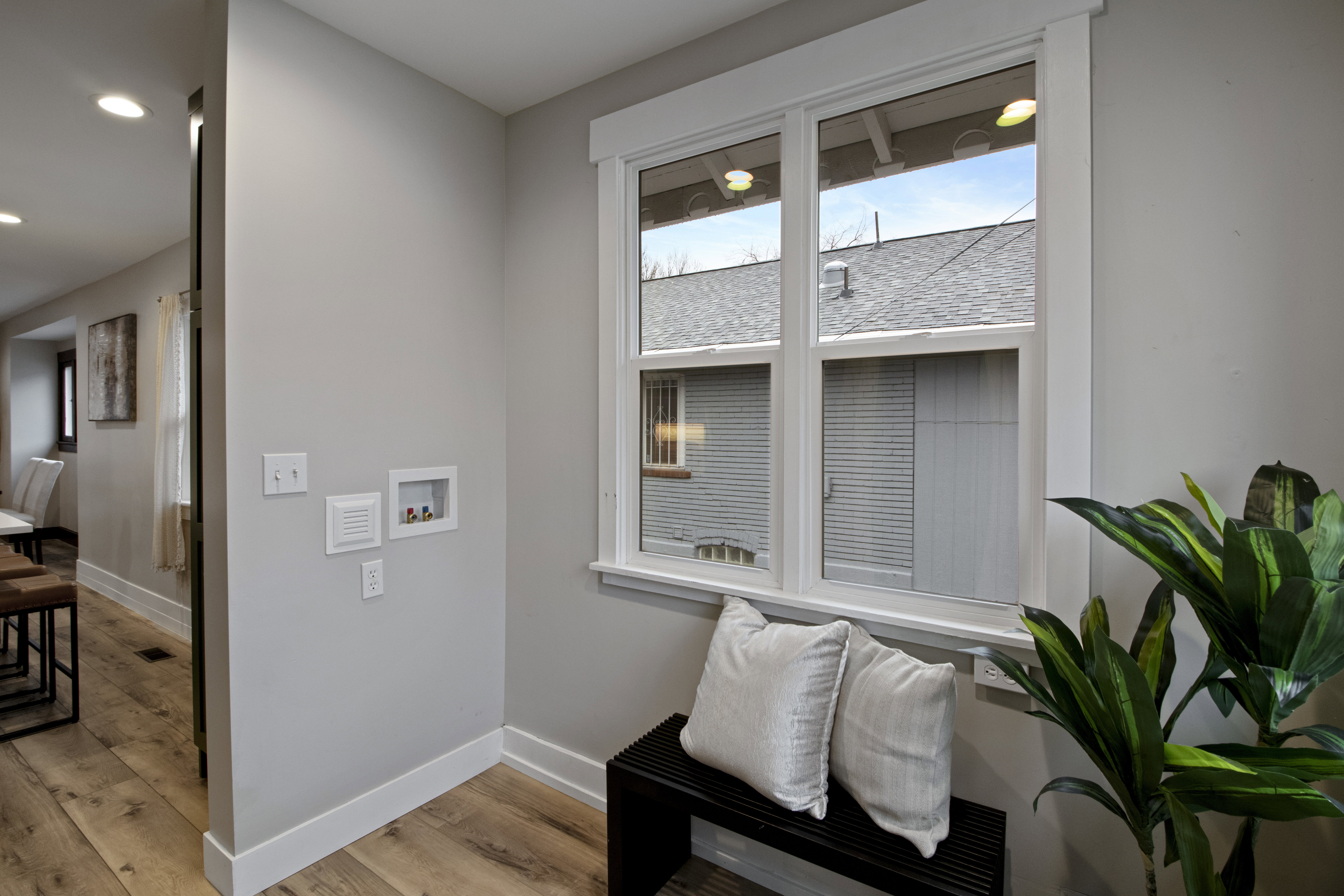 Sitting room with light wood-style flooring and recessed lighting