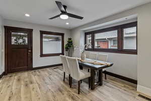 Dining space with light wood-type flooring, ceiling fan, and recessed lighting
